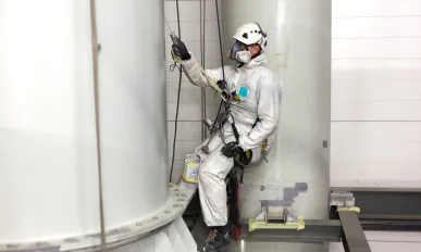 man painting with airbrush