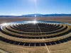 Expansive aerial perspective of a circular solar thermal power