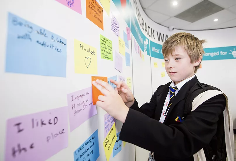 NATIONAL MANUFACTURING DAY student with notes